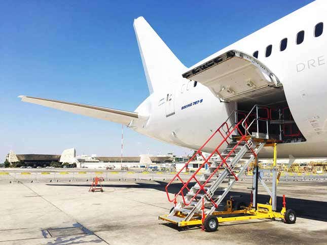 Semmco variable-height cargo bay working platform positioned at an aircraft cargo door