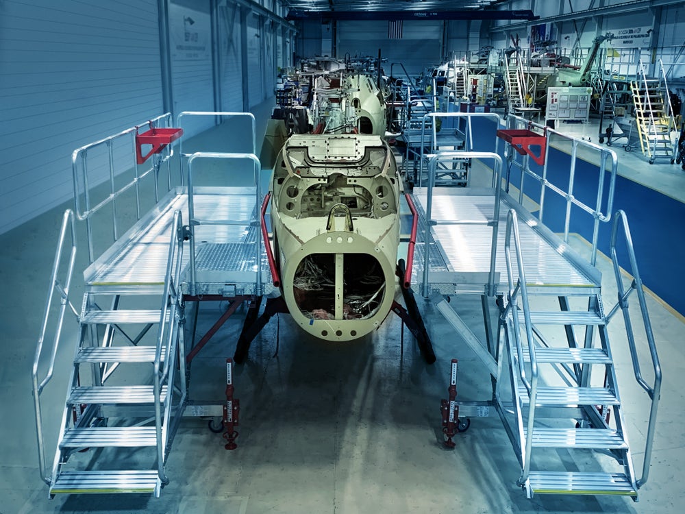 Semmco access platforms positioned around a helicopter airframe on a manufacturing line